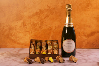 Bottle of Laurent-Perrier champagne with a box of truffles. Luxury Gift